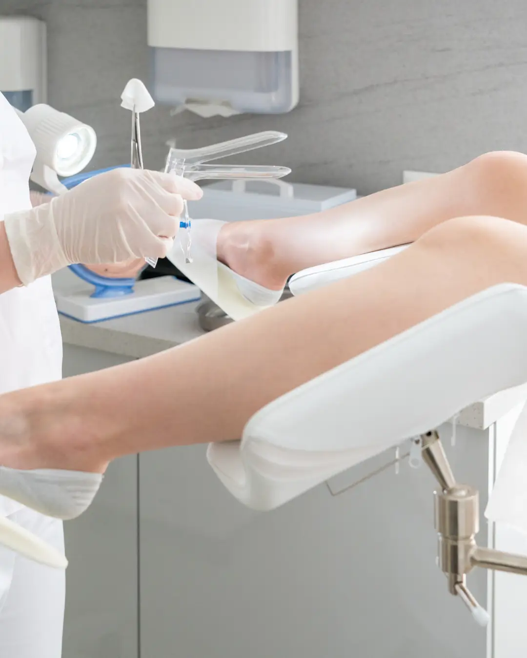 Healthcare professional preparing for a non-surgical vaginal rejuvenation procedure, showcasing medical instruments and a patient in a clinical setting.