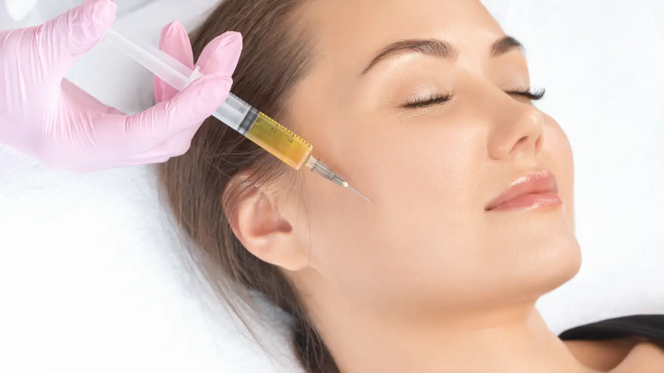 Woman receiving PRP therapy injection for facial rejuvenation, performed by a professional in a clinical setting, highlighting advanced aesthetic treatment for skin health.