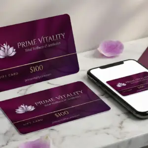 Gift card design for Prime Vitality featuring a purple background, lotus flower logo, and $100 value, displayed alongside a smartphone on a marble surface.